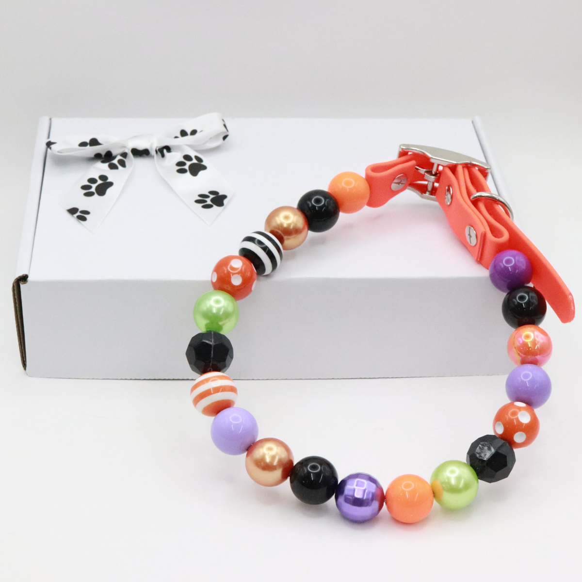 AnitasStitches adjustable Halloween dog collar with vibrant multi-colored beads and a waterproof orange Biothane strap.