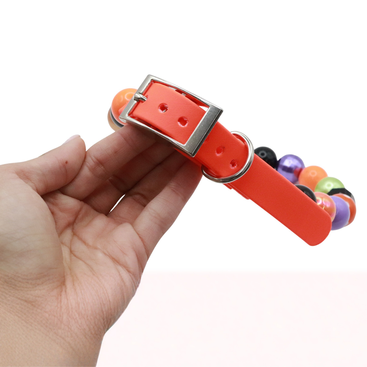 AnitasStitches adjustable Halloween dog collar featuring vibrant bubblegum beads and a waterproof orange Biothane strap.